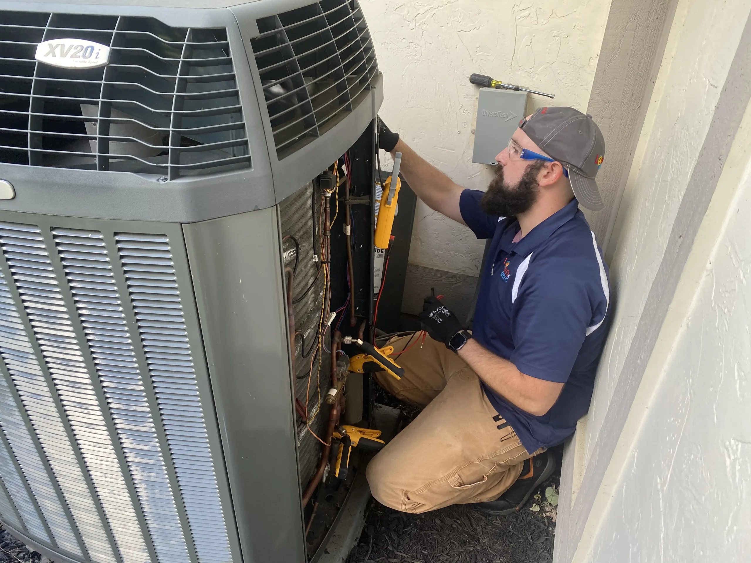 Technician installing outdoor unit